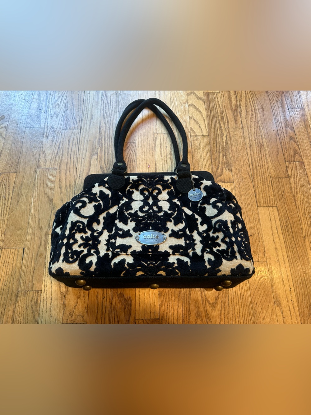 Cake by Petunia black and tan diaper bag purse with changing pad